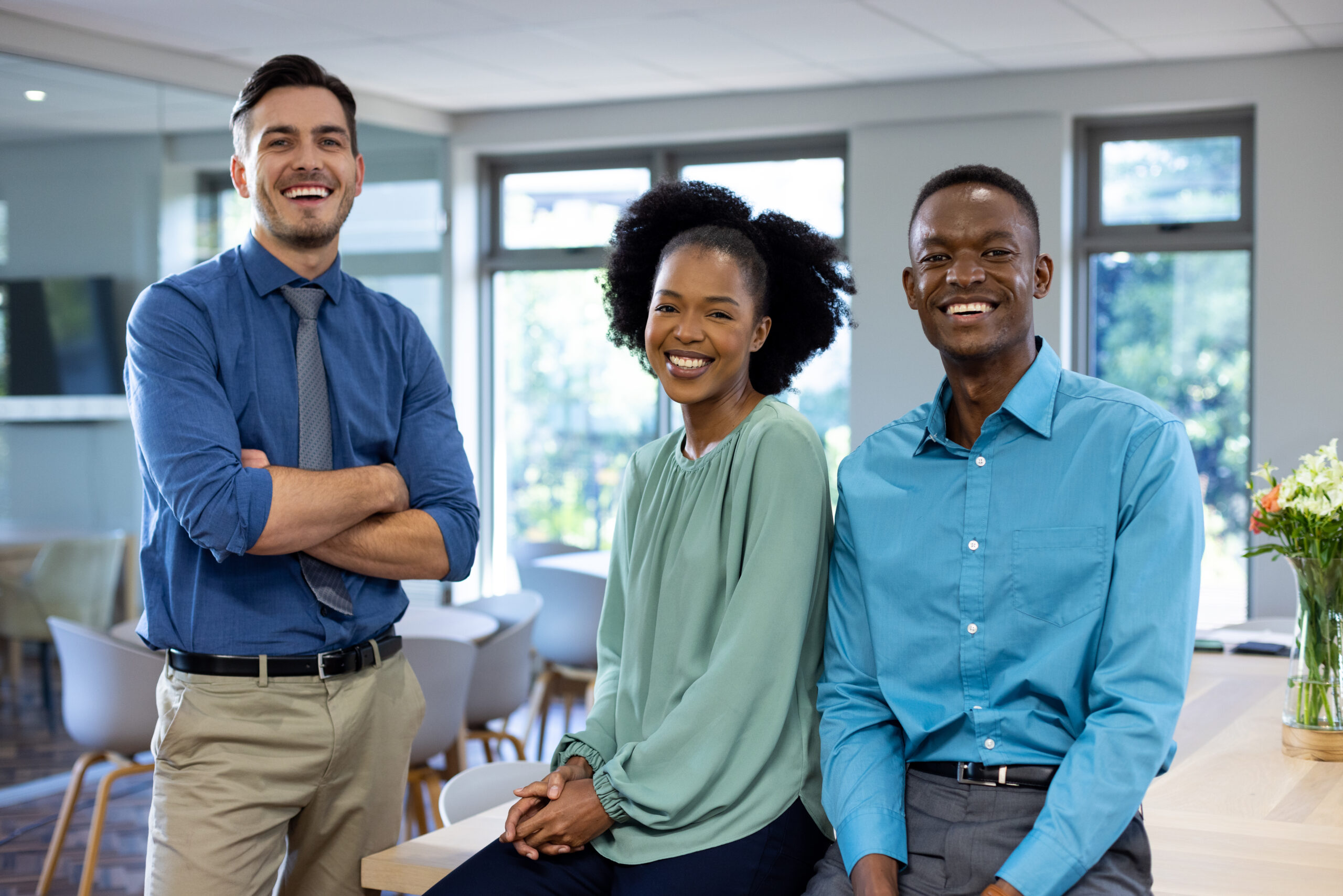 Professional services colleagues together in a modern office
